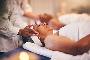 Image showing Spa, massage and head of senior woman while on table to relax for calm, peace and zen time with a therapist for health and wellness. Patient get facial with cosmetics, skincare and detox treatment