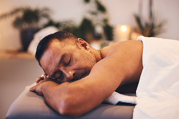 Image showing Black man, spa and wellness to relax, healing massage and vacation at resort. Mature male, lying on table and enjoy physical therapy being zen, peace and calm for body care, rest and holiday.