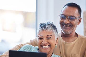 Image showing Relax, tablet or old couple streaming a movie on a website or internet via film subscription on home sofa. Comic, love or happy senior woman laughing at movies or funny comedy videos with partner