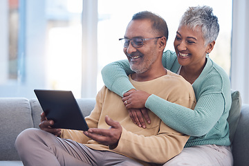 Image showing Old couple, tablet and relax with hug on sofa, social media or streaming movie. Love, retirement and elderly man and woman hugging or embrace on couch in living room while internet browsing on tech.