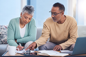 Image showing Senior black couple, taxes and home with laptop, documents or focus in home for family finance. Elderly, woman and man with computer, tablet or notebook in audit, budget or planning on lounge sofa