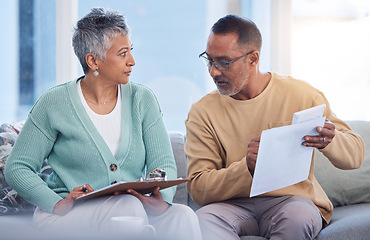 Image showing Finance, mortgage and old couple with a budget on paper for insurance bills, financial investments or taxes. Management, partner and senior woman talking, speaking or planning for economy inflation