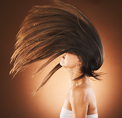 Image showing Beauty, hair care and flip profile with a model on gradient background for cosmetics, transformation and shampoo for growth and shine. Model in studio for freedom, beauty salon and hairdresser