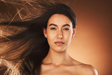 Image showing Hair care, beauty and portrait of woman in studio with healthy, long and straight hair style. Health, wellness and face of girl model with keratin or hair treatment isolated by brown background