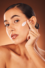 Image showing Portrait, face and woman with sunscreen for skincare, dermatology or self care grooming routine in studio. Beauty, young girl or healthy model moisturizing with a natural luxury facial cream product