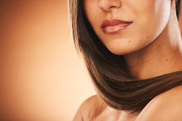 Image showing Beauty, hair care and woman in studio with healthy hair for brazilian, keratin or botox treatment. Health, cosmetic and girl with long and shiny hair style by brown background with mockup space.