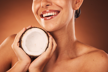 Image showing Beauty, skincare and coconut with a model woman in studio on a brown background for natural treatment. Spa, food and wellness with a young female ready to promote a health product for skin care