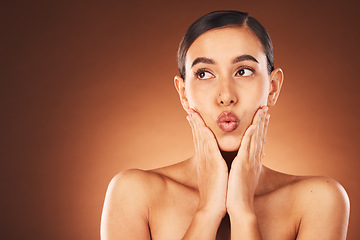 Image showing Skincare, wellness and face of woman in studio with a clean, healthy and natural skin treatment. Health, beauty and model with a cosmetic facial routine isolated by brown background with mockup space