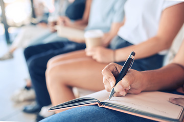 Image showing Audience, writing notes and notebook for learning knowledge at conference, meeting or workshop for training and education in convention room. Closeup, woman hands and goals with group of people