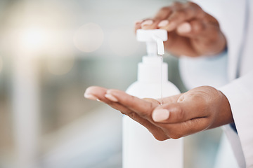 Image showing Healthcare, cleaning and covid rules at hospital by doctor disinfect hands with hand sanitizer. Compliance, safety and corona control by health expert closeup of good hygiene in fresh clean workspace