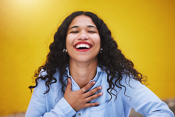 Image showing Happy, smile and fun with a woman laughing and joking in studio against a yellow background. Carefree, joy and humor with an attractive young female standing inside on a bright and colorful wall