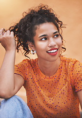 Image showing Young black woman, stylish fashion tshirt thinking and hand in trendy curly hair. Portrait of happiness, nostalgia and cool urban style. Glowing skin, sitting on the floor in jeans and happy smile