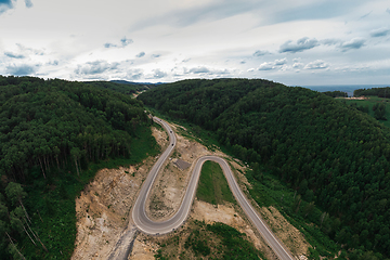 Image showing Aerial top vew of winding road in the mountains