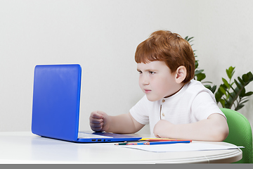 Image showing a boy looks at information