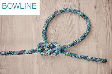 Image showing Safety, prevention and hiking rope knot in a bowline against a wooden background, ready to be used in an adventure or rock climbing. Safe, secure and strong safety measure for extreme sports