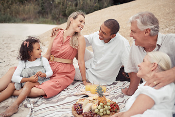 Image showing Interracial couple, girl or family picnic on beach with parents, children or grandparents by sea or ocean in Hawaii. Smile, happy or comic men, women or kids bonding in relax nature reunion with food