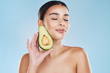 Image showing Natural beauty product, woman skincare wellness and avocado fruit for sustainable face skincare. Food hair mask health, nutrition vegetable diet lifestyle and cosmetic blue background portrait