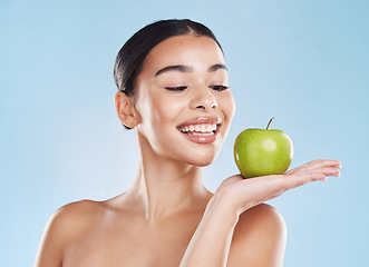 Image showing Skincare, healthcare beauty woman with apple in hand with wellness, cosmetic health and dental teeth in studio. Portrait of girl model skin, healthy diet with smile and fruit product