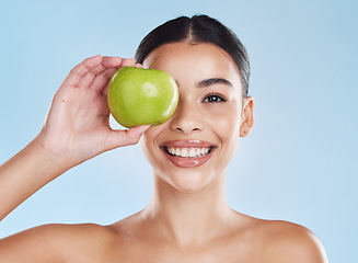 Image showing Apple, beauty and woman in a face skincare portrait showing happy, dermatology and facial health results. Young girl doing detox with natural and organic acne products with fresh fruit nutrition