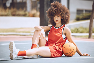 Image showing Confident female basketball coach with ball outside. Womens fitness motivation, workout, sports training and exercise wellness. Strong, powerful pro athlete posing for portrait on netball court.