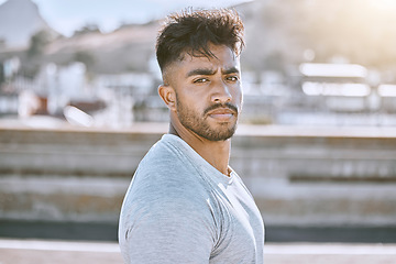 Image showing Fitness, wellness and healthy personal trainer portrait for workout, training or exercise routine in the city. Cool, tough and young man or guy with determined face for motivation or training goal