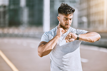 Image showing Time, fitness and runner looking at watch for running speed, pace and steps in routine workout, exercise and city training. Portrait of a confused man checking wellness, endurance and cardio health.