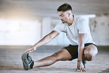 Image showing Runner stretching legs for exercise, workout and fitness training for sport performance in an urban city. Motivation, active and running wellness athlete ready for sports run, marathon or health jog