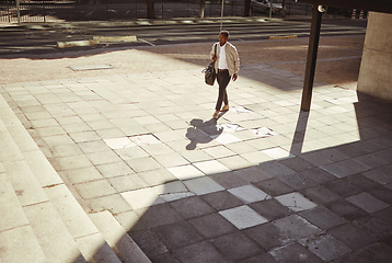 Image showing Urban city, travel and businessman walking to work, job or business career. Corporate worker man carrying bag on business travel, traveling or walking to the airport for an overseas opportunity