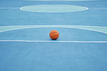 Image showing Basketball sport ball in empty basketball court to play, train and practice for tournament game and training day. Summer sports exercise and fitness workout training or practicing for competition