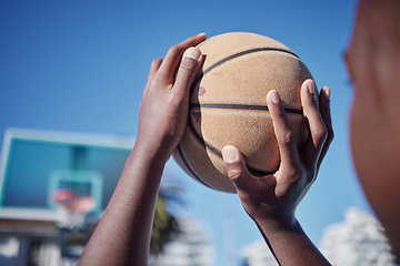 Image showing Basketball court, sports man or fitness with motivation, vision or wellness goal in training, workout or exercise. Closeup player or competition athlete hands and basket ball shooting for net in game