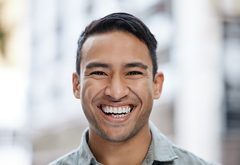 Image showing Happy, smile and face portrait of a man with a vision, mindset and motivation for success. Young entrepreneur or corporate professional businessman smiling in happiness over city street background.