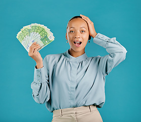 Image showing Surprised, rich and finance businesswoman holding cash prize, savings investment or salary. Portrait of young, wealthy shocked female with lottery, jackpot or profit money after winning or investing