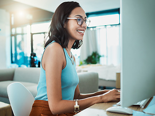 Image showing Social media agent with computer browsing online, typing and replying to customer or client emails in home office. Motivated, inspired and smiling creative business woman planning marketing strategy