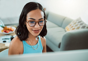 Image showing Confident young female worker with spectacles, working from home office alone in virtual team meeting. Professional freelance entrepreneur, trendy cool workspace, watching tv series in lockdown.