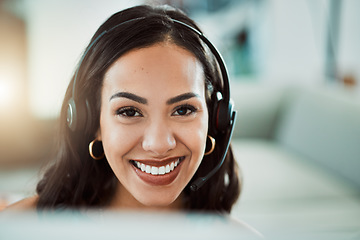 Image showing Call center, customer service and help desk agent looking friendly, happy and smiling while wearing a headset and working on a computer. Portrait of Cheerful sales employee, remote or virtual worker
