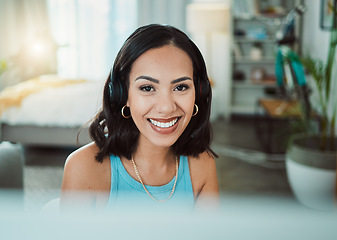 Image showing Call center, customer service and sales support with a female agent or representative wearing a headset and remote working from home. Portrait of a young woman helping, assisting or talking on a call