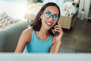 Image showing Working from home freelancer talking on phone while doing remote work on computer. Smiling, happy and motivated woman thinking, consulting and planning idea with communication and network for startup