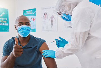 Image showing Thumbs up, vaccine and covid injection on a mans arm with him wearing a mask to stay safe. Doctors needle injecting a healthy male protecting against corona virus by taking treatment in a hospital