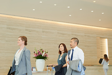 Image showing Business, corporate team in hotel and walking to international meeting, company workshop and coaching seminar. Employee trade show, management work conference and executive job teamwork collaboration