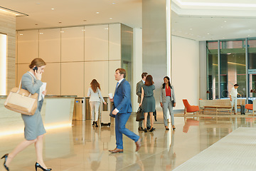 Image showing Business people, walking and an airport terminal for travel, global trade and success. Working, group and workers take steps though lobby with communication, check in and catch international flights.