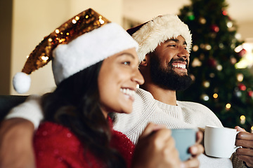 Image showing Christmas, couple on couch and hot chocolate with smile or happiness to relax, festive season and at home together in living room. Xmas, love and man with woman, eggnog or loving together for bonding