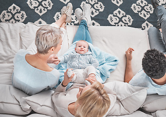 Image showing Bonding, above and baby with family on the sofa in the living room of their house with care. Love, happy and parents with grandmother and portrait of a child playing with affection on the couch