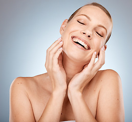 Image showing Face, beauty and skincare with a model woman in studio on a gray background for luxury or wellness. Facial, cosmetics and antiaging with an attractive young female posing to promote natural treatment