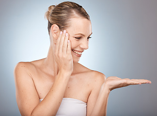 Image showing Beauty, skincare and woman in a studio with mockup space for a health, wellness and natural face routine. Cosmetic, healthy and happy girl model with a facial treatment by a gradient gray background.