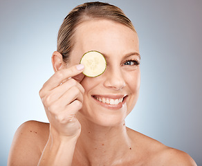 Image showing Cucumber eye and skincare portrait of woman with healthy, fresh and clean face satisfaction. Self love, wellness and skin detox model with natural beauty smile on gray studio background.