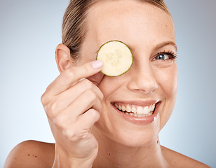 Image showing Woman, skincare face or cucumber in eye care on studio background for healthcare wellness, self care or Canada facial treatment. Portrait, smile or happy beauty model with vegetables in organic detox