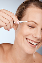 Image showing Woman, face and eyebrow hair on face with tweezers and cosmetic therapy in studio grey background. Facial, clean and makeup in beauty, natural cosmetics with tool and clean skincare with happy smile