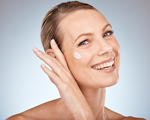 Image showing Beauty portrait and woman with skincare cream dot for skin anti aging, health and sunscreen care. Wellness, lotion and self care face of girl with happy smile on gray studio background.