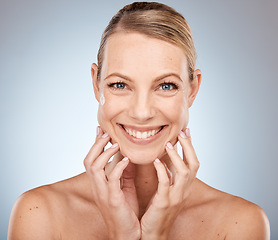 Image showing Portrait, face and beauty with a model woman in studio on a gray background for natural skincare treatment. Happy, smile and luxury with an attractive young female posing to promote skin cosmetics