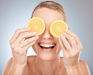 Image showing Lemon, eyes and skincare woman in studio for cosmetics, makeup and health of nutrition benefits and results promotion. Happy model with fruits for vitamin c on skin care, dermatology and facial